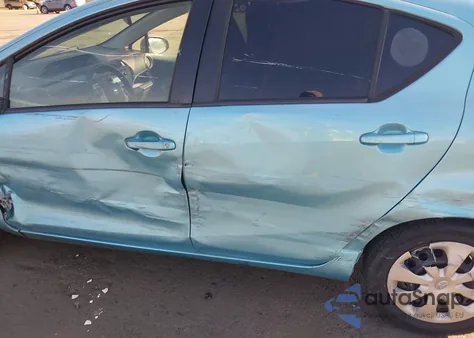 2014 Toyota Prius C One from USA, damaged, VIN JTDKDTB33E1084502